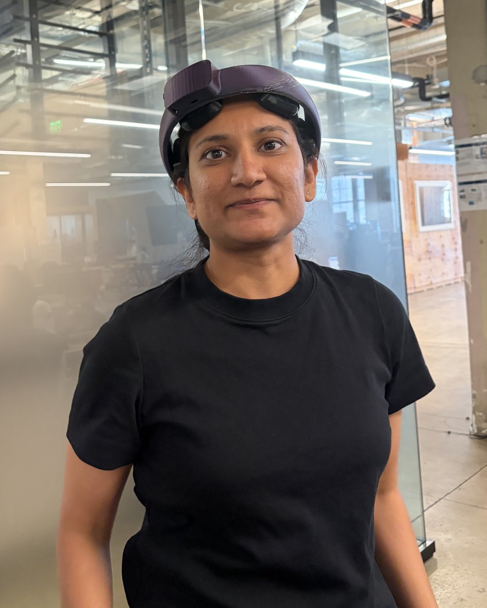 Another team member wearing the v5 NeuroLingo headset during a fit session