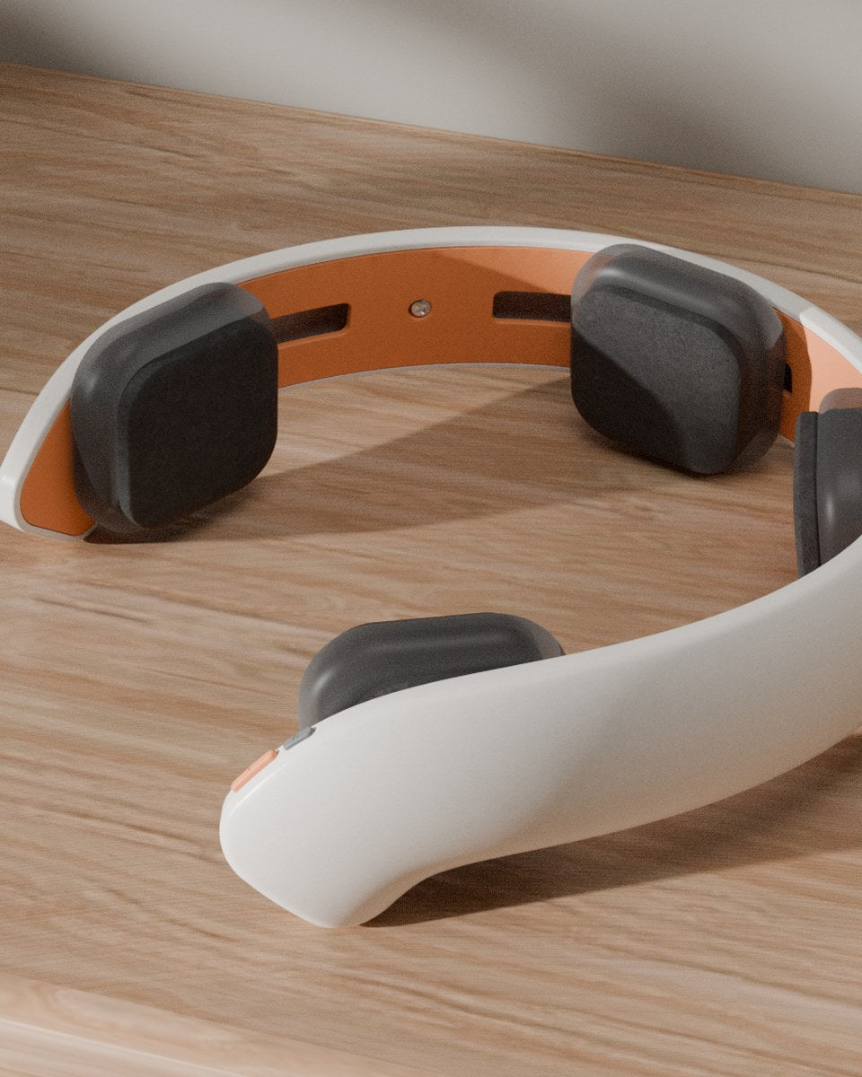 Render of the v5 NeuroLingo headset from behind, showing the grey electrode pods on their tracks against the orange inner band